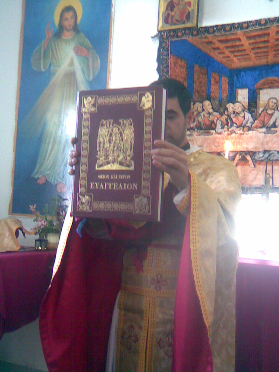 Priest blessing the olive and palm branches