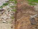 Hole in the ground for the pipe